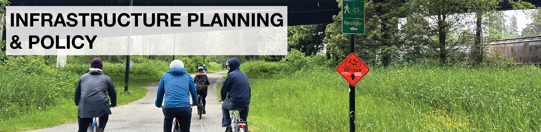 Infrastructure Planning & Policy. A group of people ride on cycling infrastructure in Burnaby.