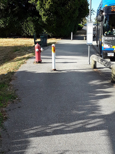 Sign, bollard, and hydrant on the pathway. 168 St MUP | Surrey, BC. Photo credit: John Burgess